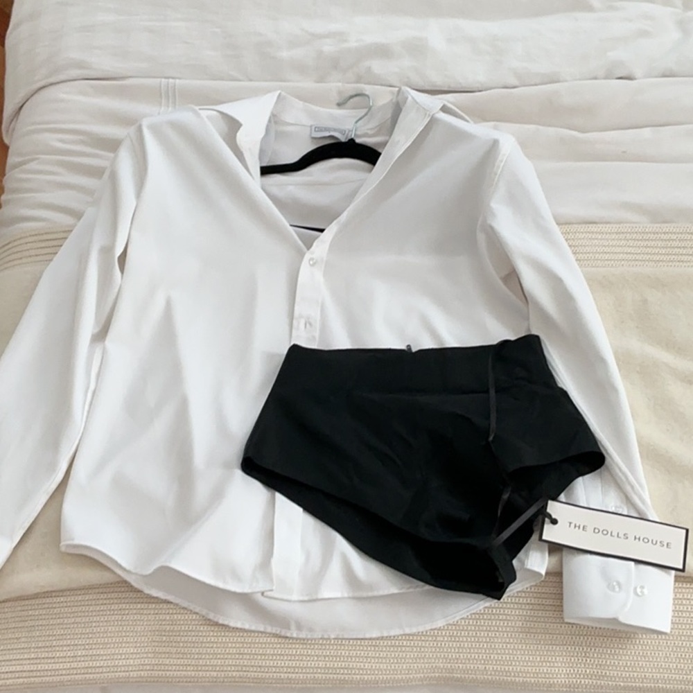 Crisp White Shirt Shoulder Pads and Black Shorts Ensemble